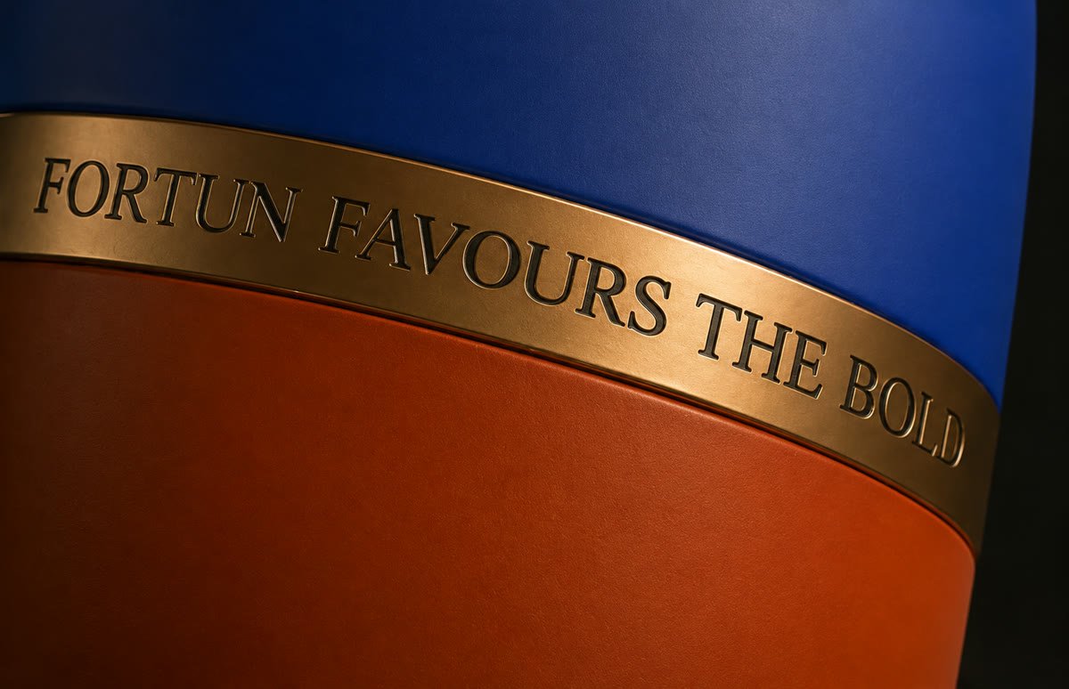 Engraved gold ring reading Fortun favours the bold
